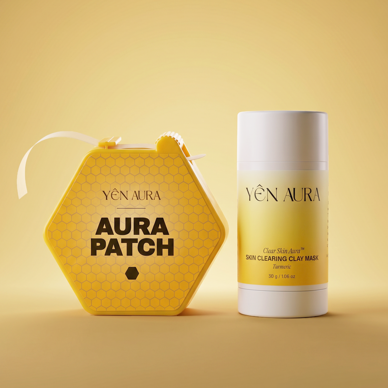 Yen Aura Patch skin clearing clay mask set, featuring a yellow hexagonal patch container with a white ribbon and a matching yellow-and-white cylindrical stick container, set against a warm yellow background.